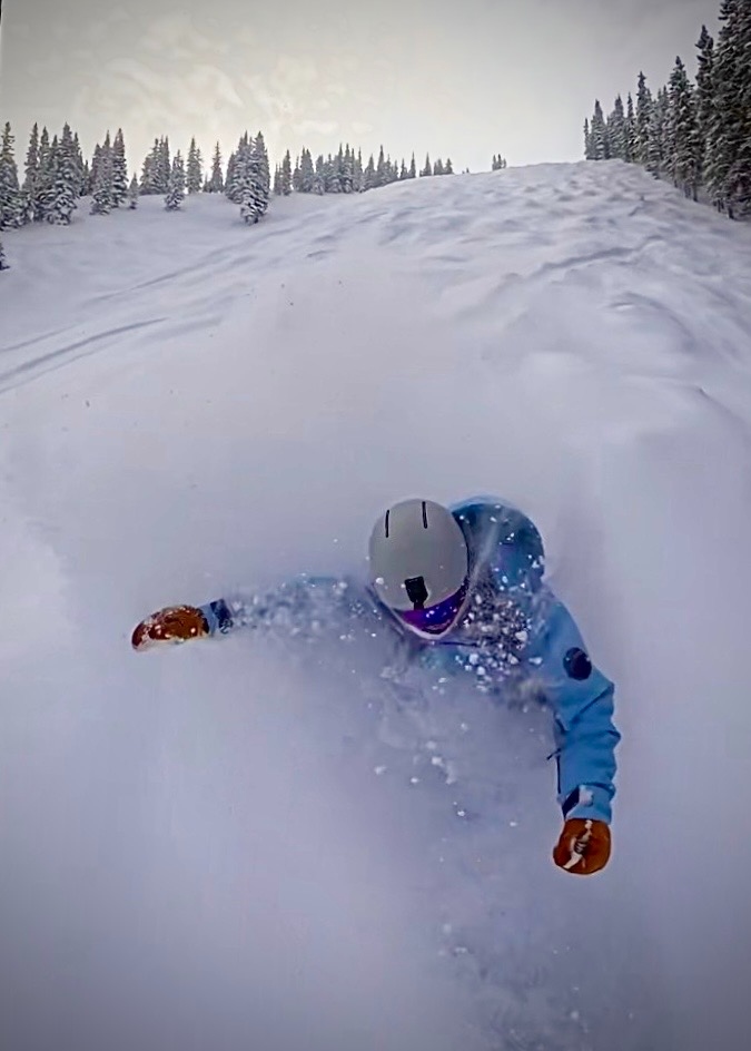 Snowboarder in deep powder